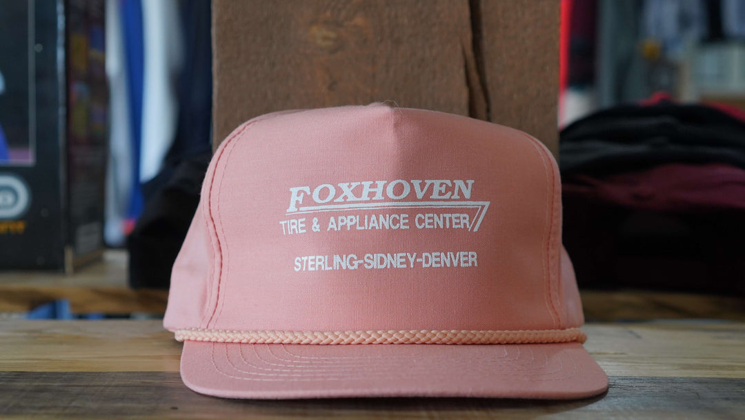 Vintage Foxhoven Tire & Appliance pink rope hat from the 90s, featuring store locations, available from West Block Vintage—ideal for lovers of unique retail and trucker hats.