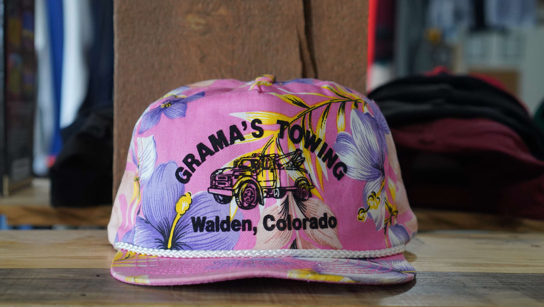 Grama's Towing Walden Colorado pink floral rope hat with vintage floral design, from West Block Vintage—perfect for collectors of unique country trucker hats.