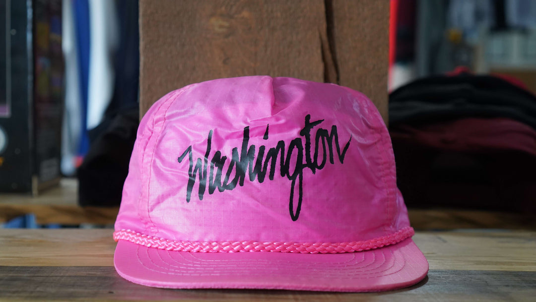Washington pink vintage rope hat with black script and classic rope detailing, from West Block Vintage—perfect for collectors and fans of unique 90s country trucker hats.